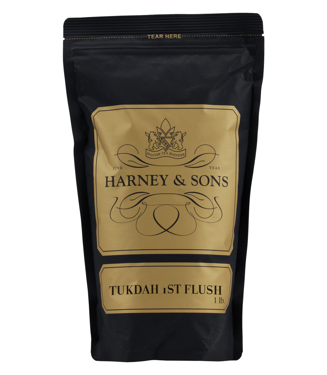 Black packaging of Harney & Sons Tukdah 1st Flush tea, featuring gold accents and a tear-off top.