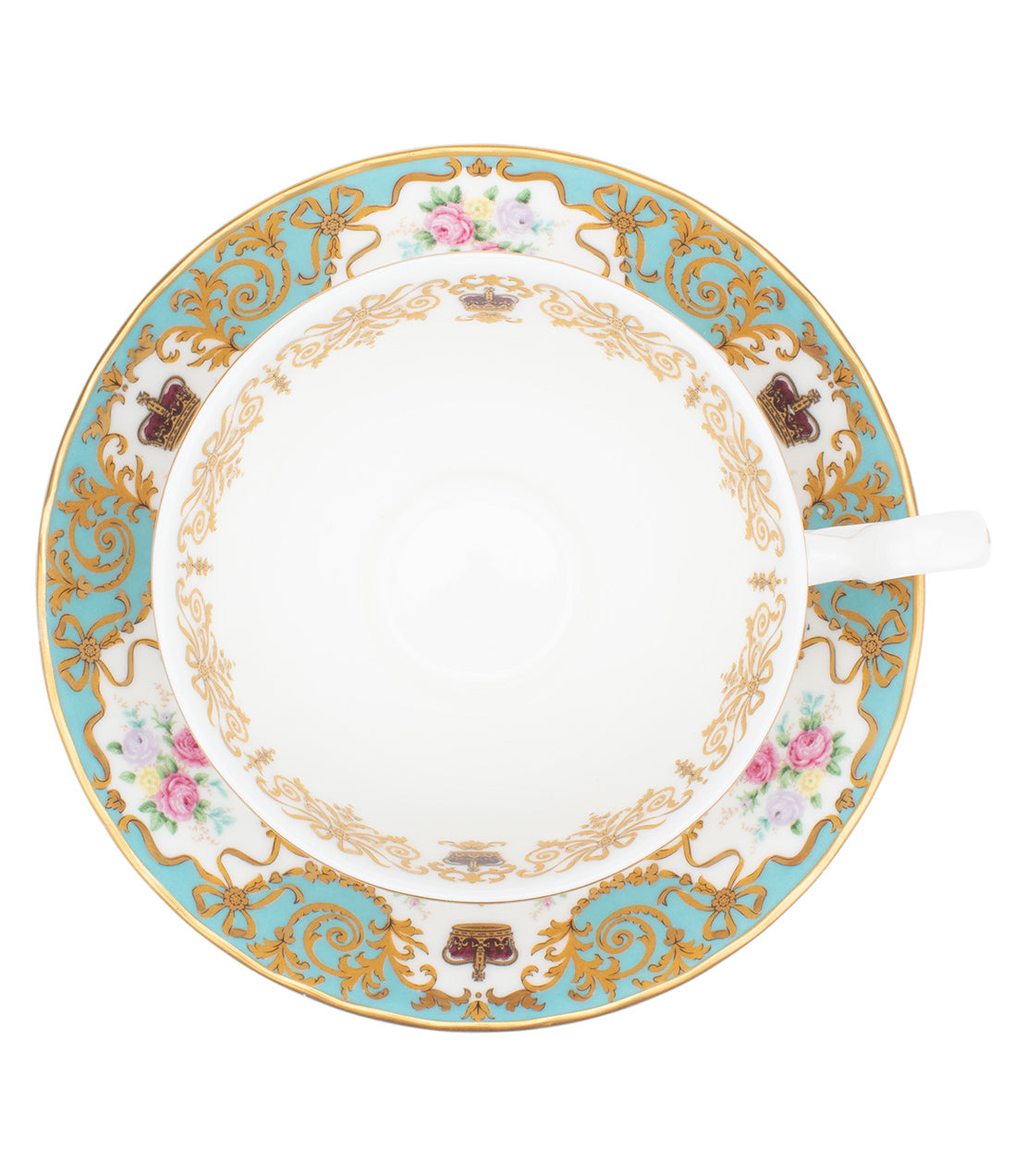 Elegant historic teacup and saucer featuring intricate gold detailing and floral patterns on a turquoise background.