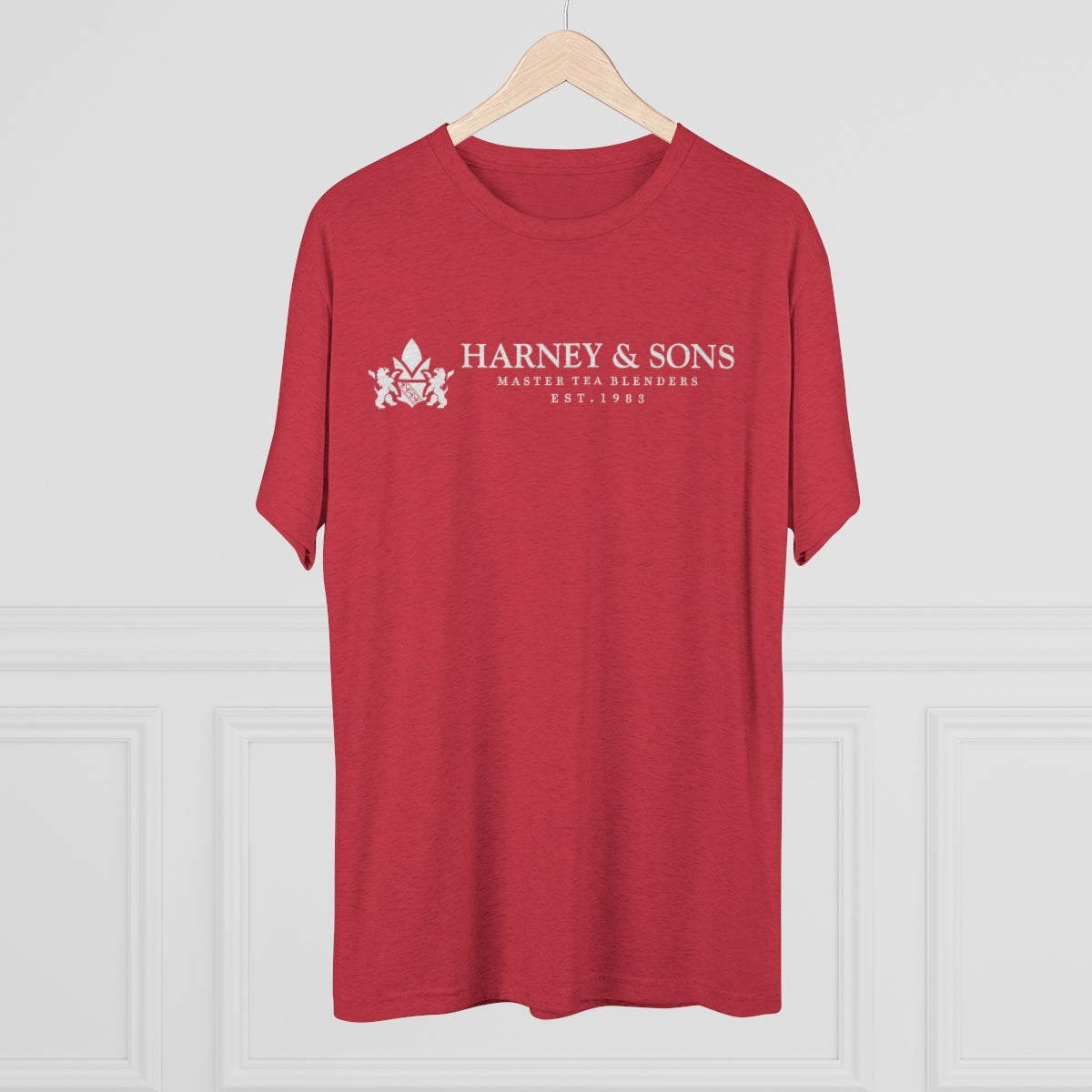 Red graphic tee featuring "Harney & Sons Master Tea Blenders Est. 1983" in white text. Perfect for tea enthusiasts.