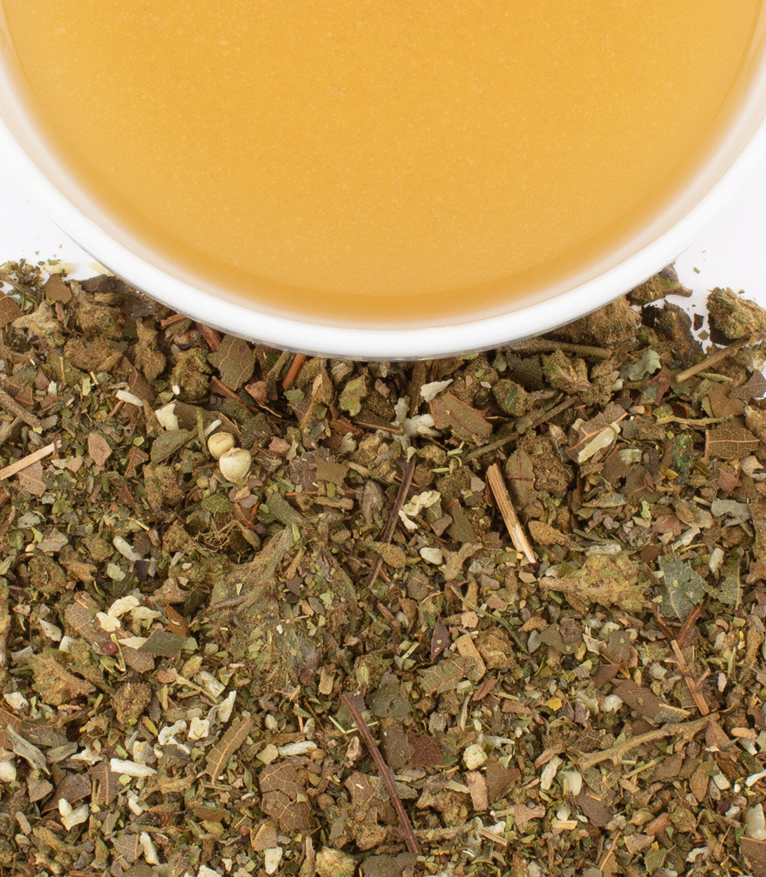 Hemp avocado sachets with herbal blend and a cup of infused liquid, ideal for health-conscious consumers.