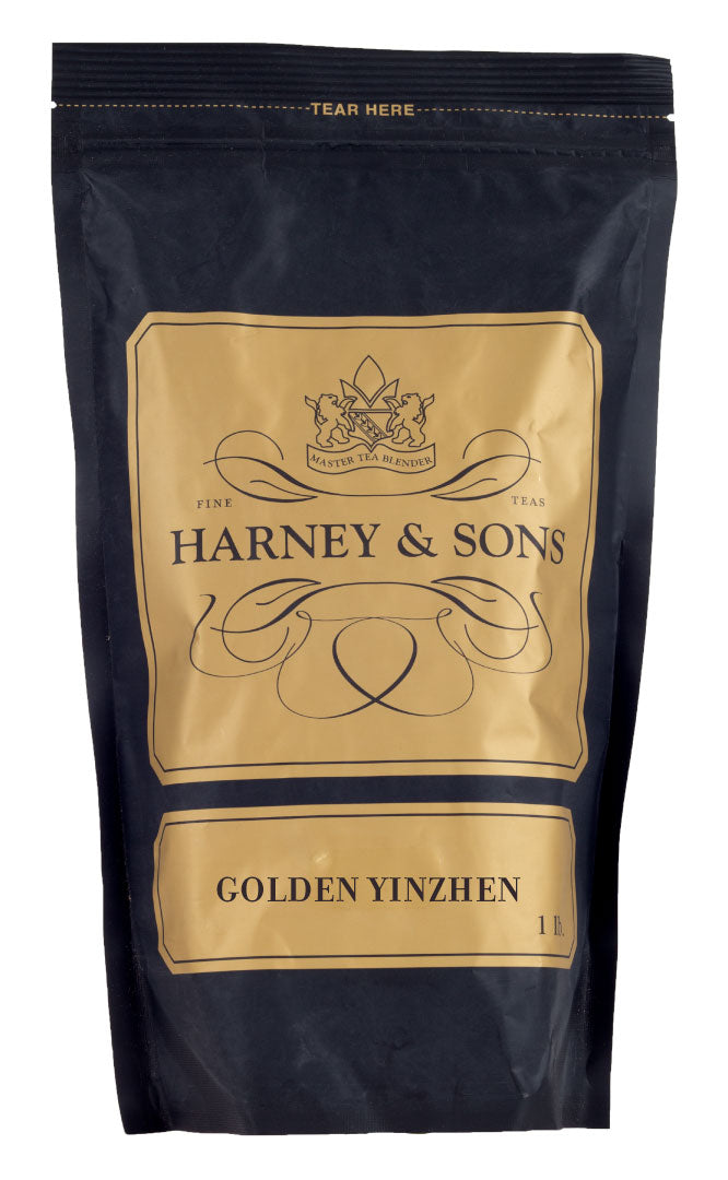 Black tea packaging featuring "Golden Yinzhen" label by Harney & Sons, with elegant gold accents.